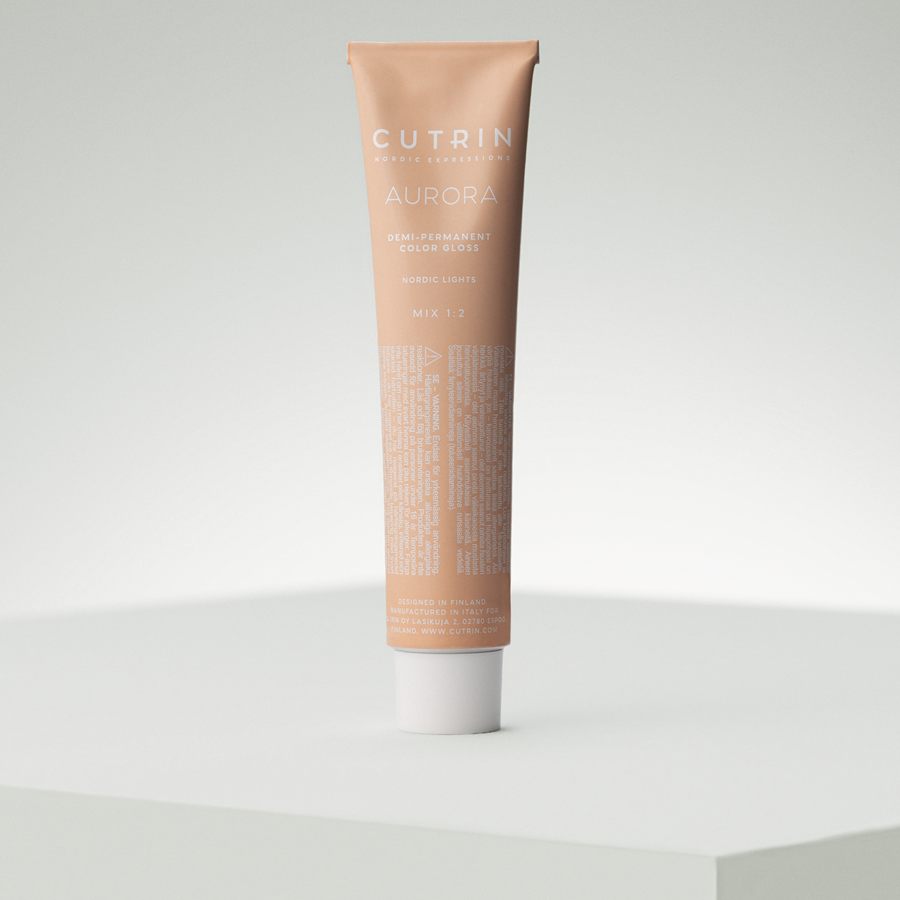 Single Cutrin Aurora demi-permanent colour gloss tube on a pale plinth
